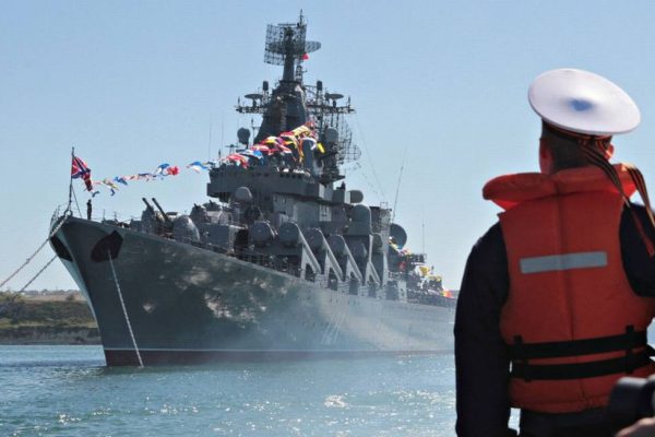 98623277_FILE-PHOTO-A-sailor-looks-at-the-Russian-missile-cruiser-Moskva-moored-in-the-Ukrainian